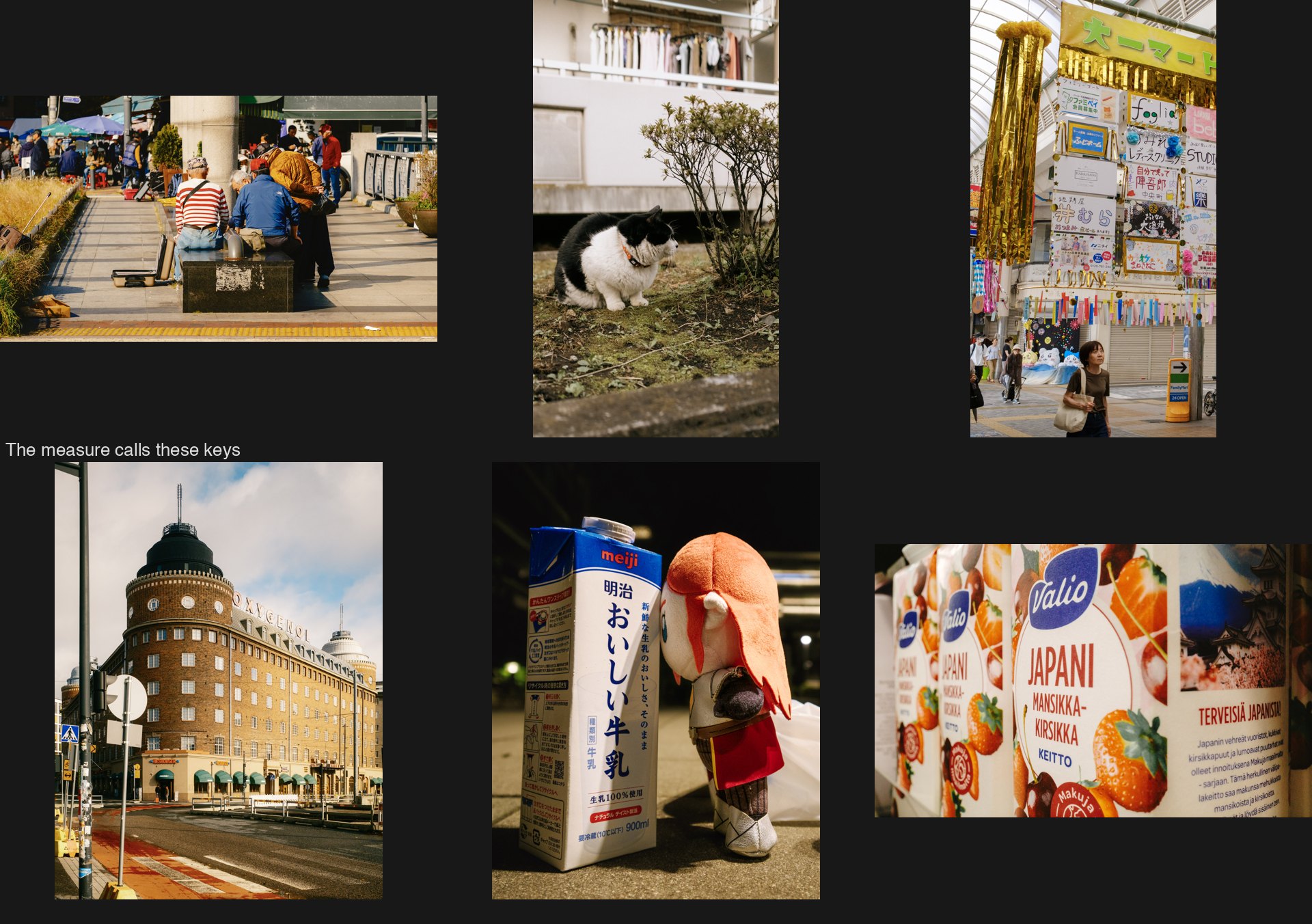 Six frames the number calls keys that are not held: a market bench, a corgi, tanabata streamers, a brick building, a milk carton and doll, cartons on a shelf.